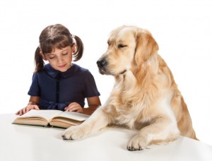 picture of a girl reading to her dog